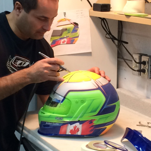 Lyons busy working on his latest lid for a Canadian driver.